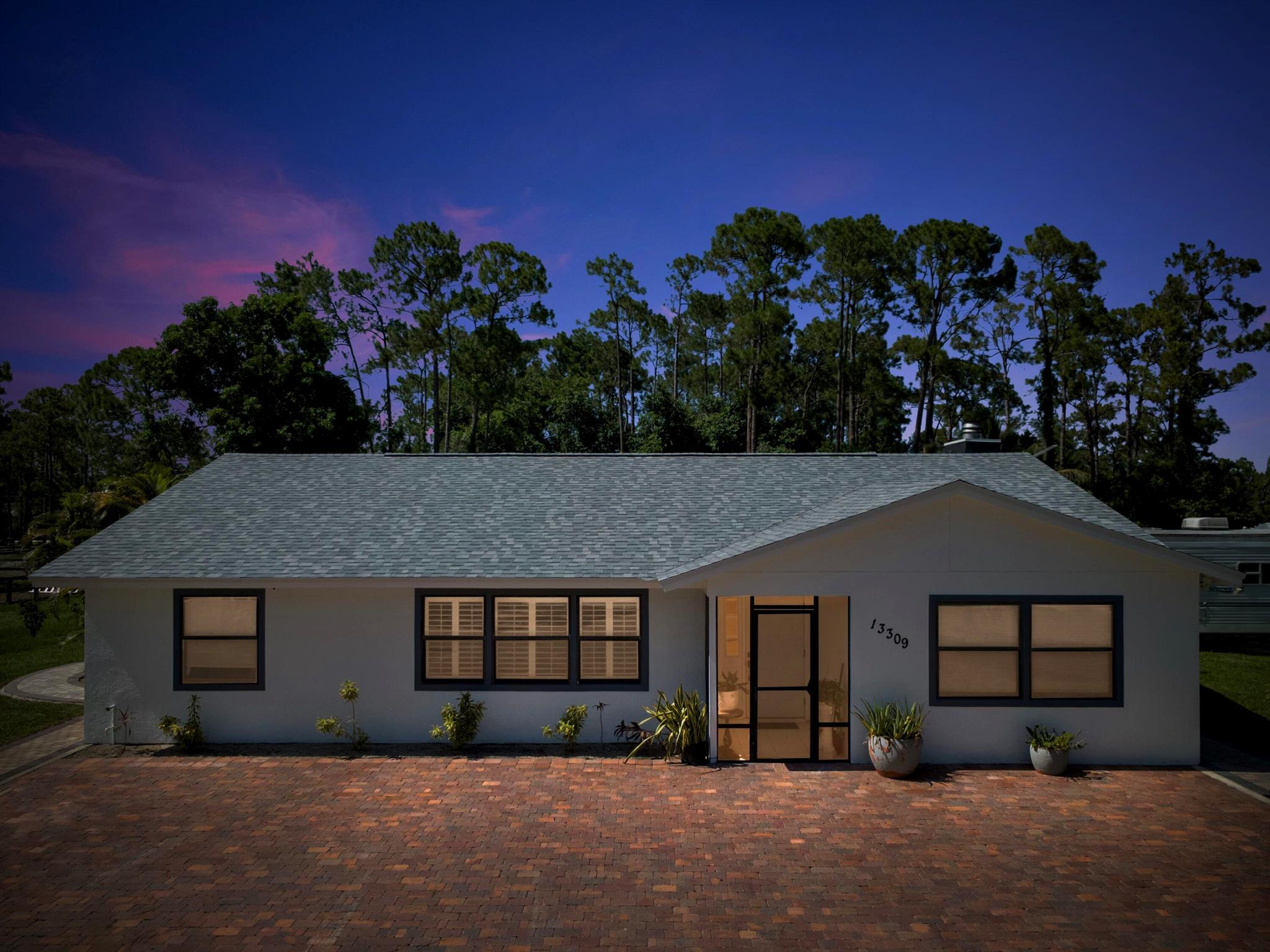 Welcome to this wonderful family home featuring 3 bedrooms and 2 bathrooms, designed for comfort and peace of mind. All windows are impact-rated for hurricane protection.The property includes a spacious 22' x 19' barn, perfect for storage or hobbies. Enjoy the outdoors in the screened and covered patio, which stretches an impressive 70 feet long by 12.5 feet wide--ideal for entertaining or relaxing year-round.Step outside to an extra-large wooden deck in the backyard, offering plenty of space for gatherings or enjoying nature. The entire property is fully fenced, providing privacy in a peaceful, tucked-away locatio