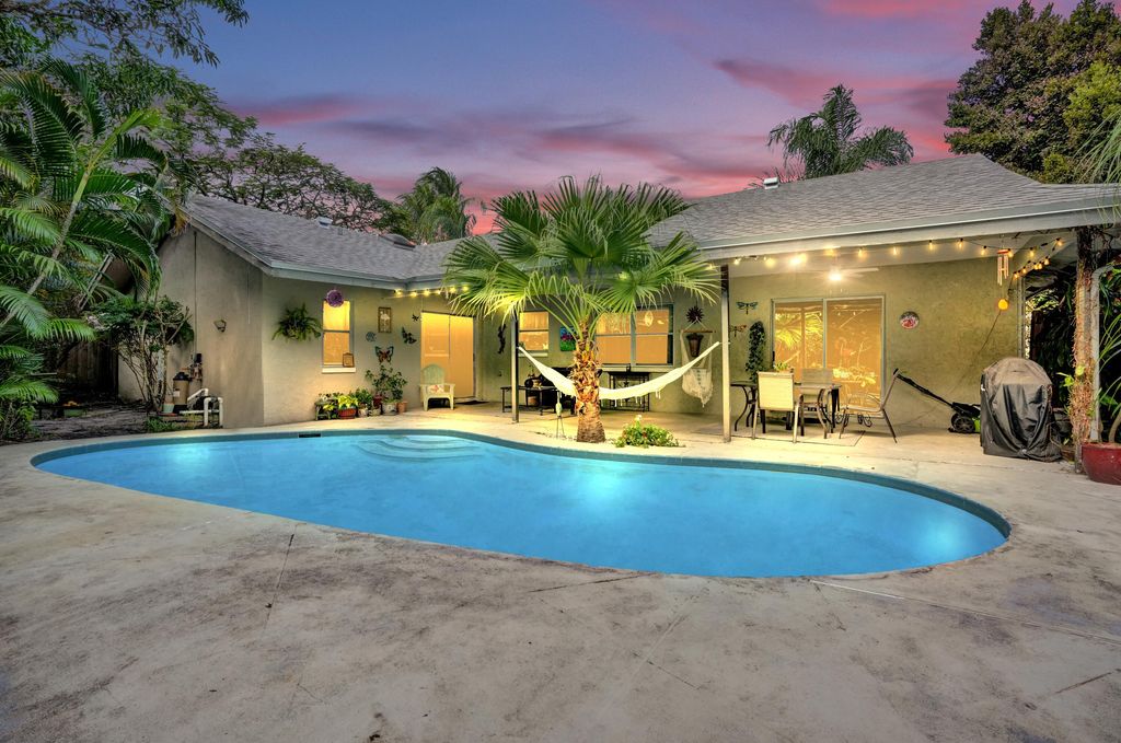 Photo of 194 Parkwood Drive, Royal Palm Beach, FL 33411 (MLS # R11151661)