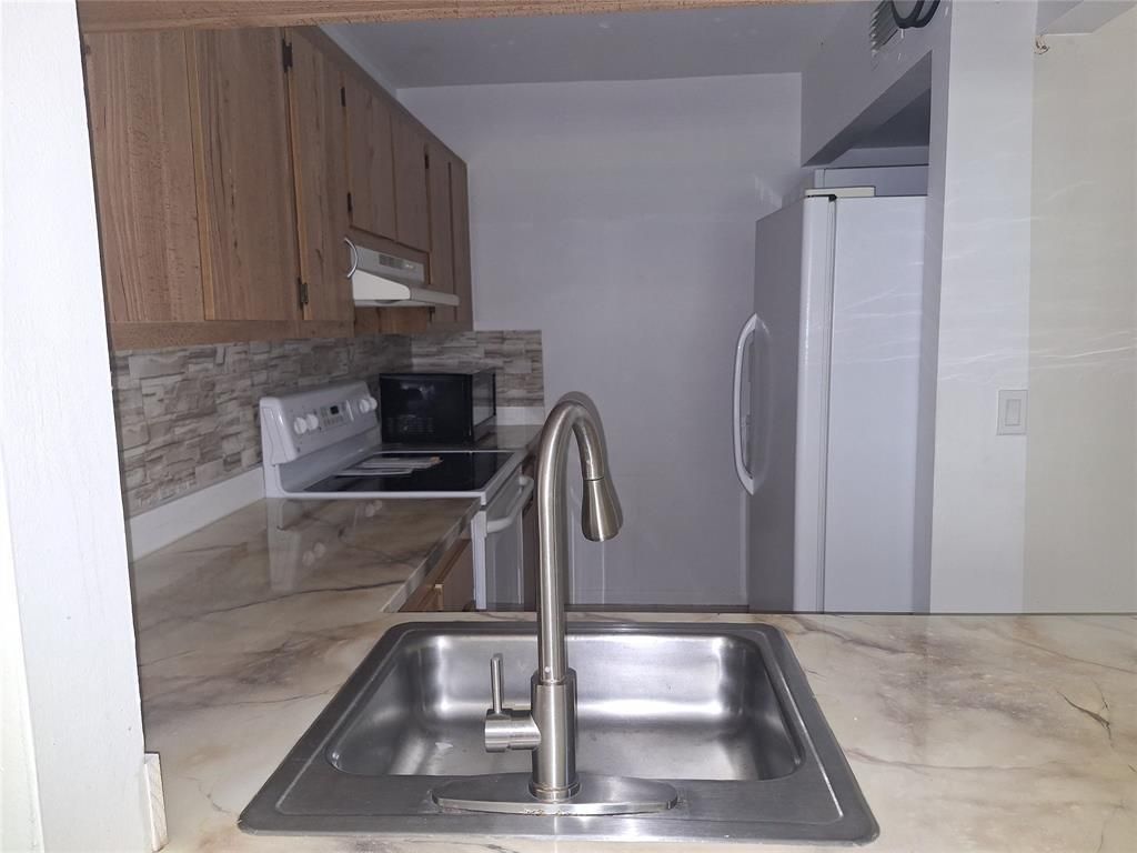 Photo of 10037 Winding Lake Rd #102, Sunrise, FL 33351 (MLS # F10541427)