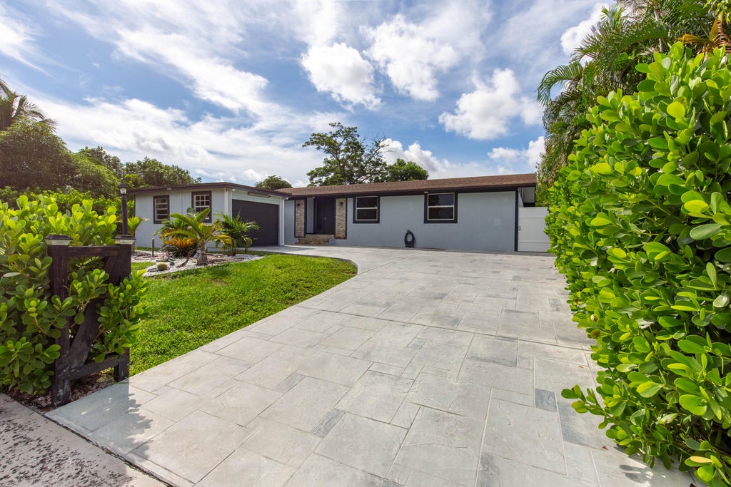 Photo of 3834 Mackinac Road, Lake Worth, FL 33462 (MLS # R11024270)