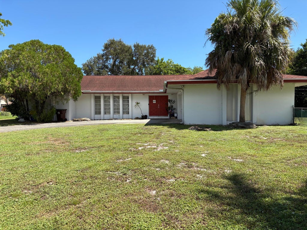 Photo of 8432 Waterway Drive, Lake Clarke Shores, FL 33406 (MLS # B26069931)