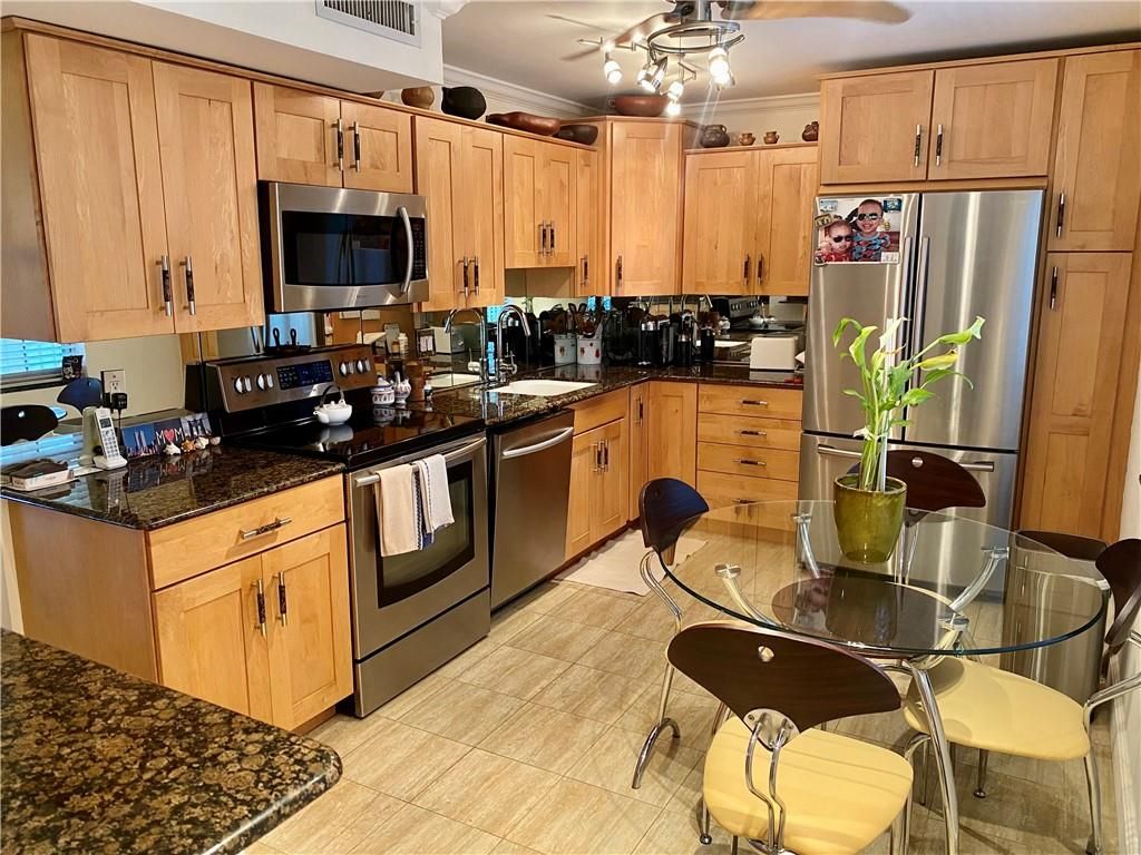 Photo of 800 Cypress Grove Dr #302, Pompano Beach, FL 33069 (MLS # F10294852)