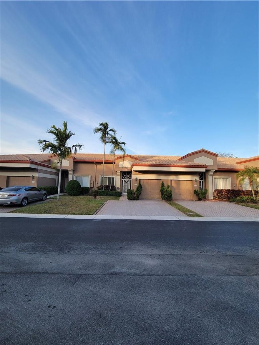 Welcome home to your piece of paradise. Located in the gated Lombardy subdivision of King's Point in West Tamarac. This fully remodeled villa features an upgraded kitchen with all new appliances. NEW AC and W/D (2021). NEW ROOF currently being installed. Enjoy spacious living area and bedrooms with vaulted ceilings. New tile and vinyl floors throughout; NO CARPET. Large walk in closets in bedrooms. New bathrooms with accent lighting under counters. Owners suite with double walk in closets and en suite bathroom with duel sink vanity, roman tub and separate shower. Large enclosed patio with small backyard. Association says 55 and older. Showings begin June 4th. Your lovely home awaits, but not for long. Multiple offers expected.