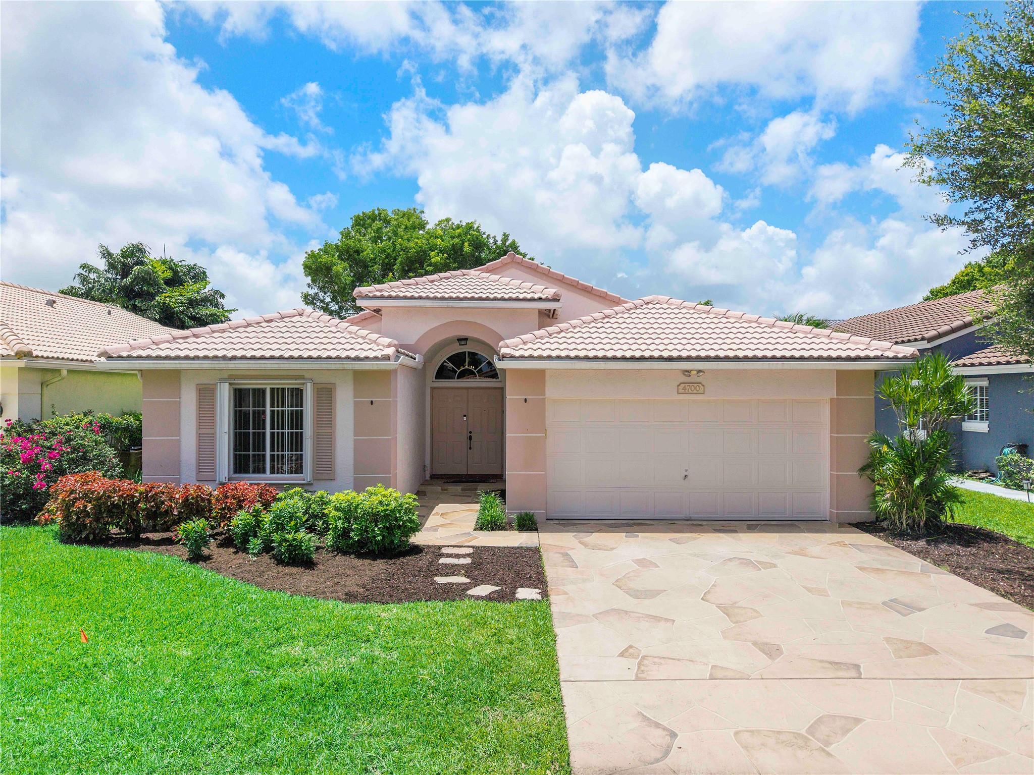 3 Bedroom, 2 bathroom home nestled in desirable Deerfield Beach. This property offers a spacious & open layout with an updated kitchen, split floorplan, & large fenced yard. You will love the over-sized primary suite with 2, huge closets & an ensuite bathroom boasting dual vanities.
The additional bedrooms are positioned off the entry, across from the interior laundry room/ 2-car garage. Large format tile runs throughout the home & neutral paint allows you to simply unpack & enjoy.
Further conveniences include a LOW HOA covering lawn care & community amenities- sparkling pool & clubhouse.
Deerfield is desirable for local conveniences, world-famous beaches, unique entertainment, incredible dinning & proximity to travel hubs! Welcome to paradise!