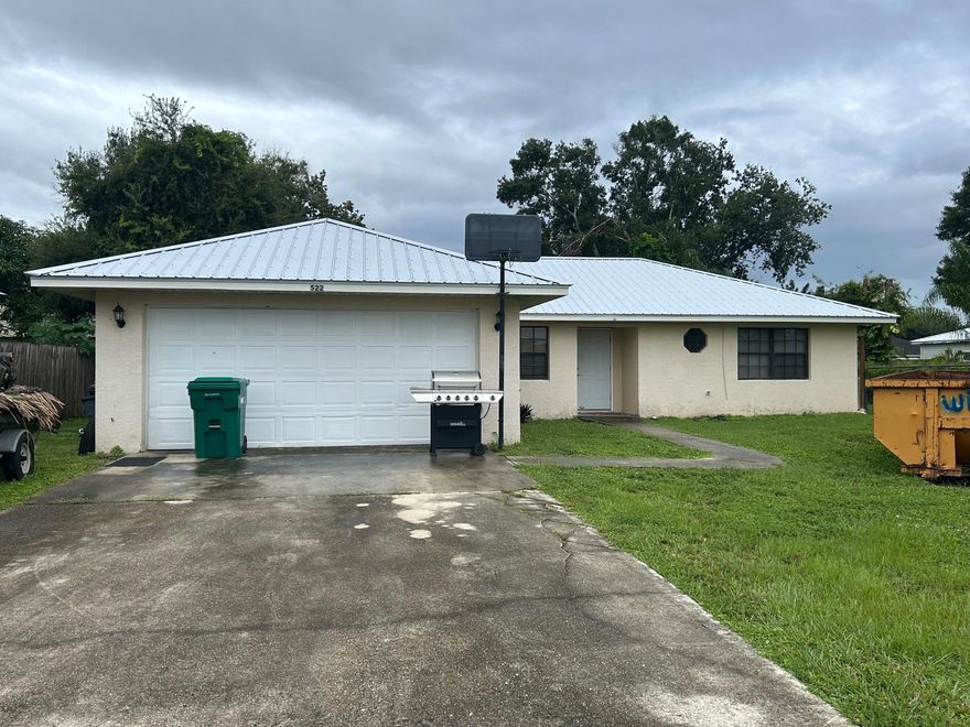 Charming SE Okeechobee Home with Recent Upgrades! Welcome to this beautifully updated 3/2 home located in  Southeast Okeechobee! Featuring a brand-new metal roof installed in 2024, this home offers peace of mind and lasting durability. Inside, you'll find all appliances just 1.5 years old, brand new flooring throughout, and a bright, modern interior that’s move-in ready. Enjoy a spacious two-car garage, a fully fenced backyard perfect for pets or outdoor gatherings, and a layout ideal for families or anyone seeking comfort and convenience.
Located just minutes from town, close to local schools, and offering easy access to Highway 710, this home combines the best of quiet neighborhood living with great connectivity. Don't miss out on this turnkey opportunity in a great location!