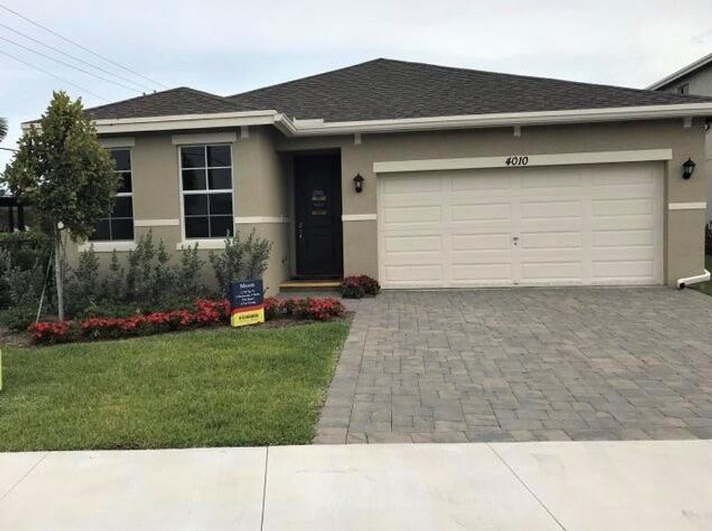 Photo of 4010 Tomoka Drive, Lake Worth, FL 33462 (MLS # R10927114)