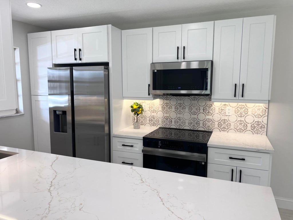 Photo of 1367 High Point Way #D, Delray Beach, FL 33445 (MLS # R11060051)