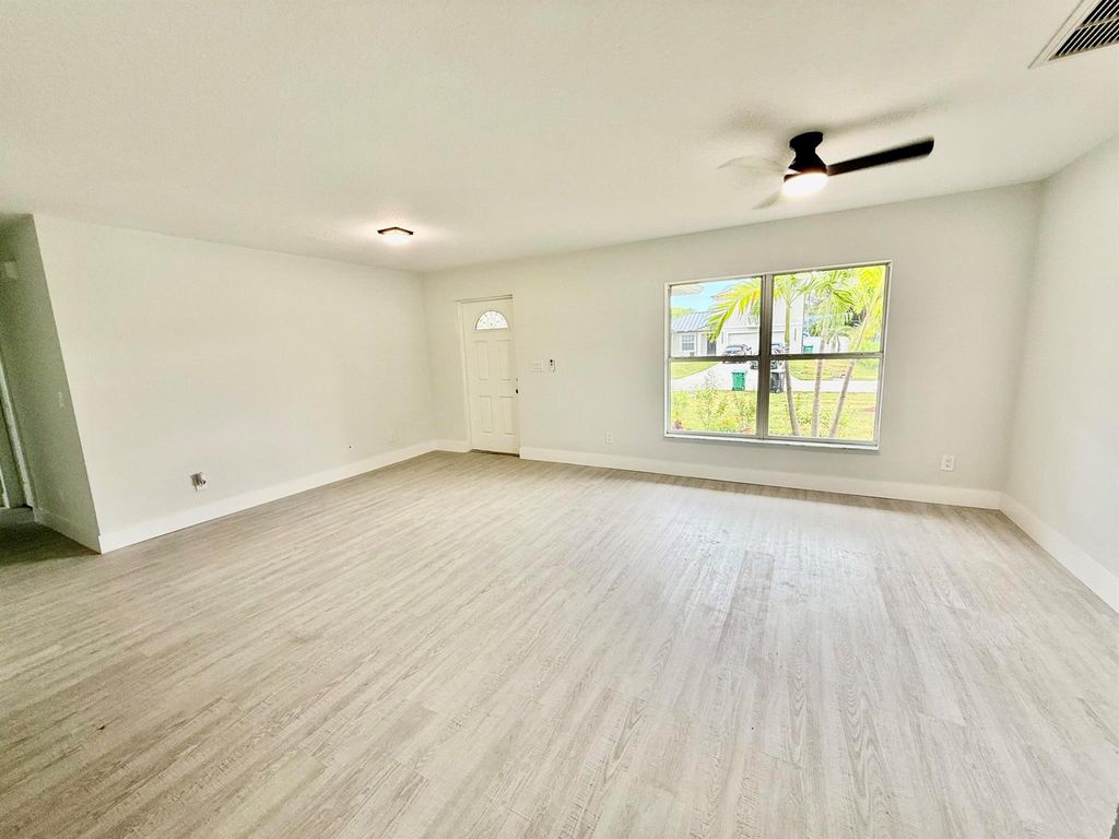 Photo of 1042 SW Cairo Avenue, Port St Lucie, FL 34953 (MLS # R11113953)