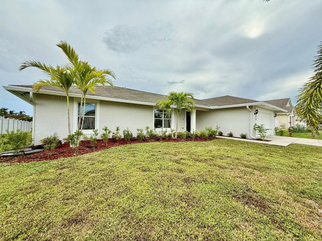 Photo of 1042 SW Cairo Avenue, Port St Lucie, FL 34953 (MLS # R11113953)
