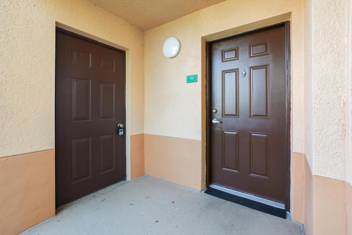 Excellent buy on this pristine 2/2 first floor condo with a beautiful lake view and ceramic tile throughout. New roofing was installed in 2025 and owner has paid in full the roof assessment. This unit boasts granite counters in kitchen and baths, spacious living area and bedrooms, stainless steel appliances, laundry room with washer and dryer in unit, large master walk-in closet, double sinks in master bath and a roomy exterior storage closet. The Club at St. Lucie West is a gated community with a beautiful clubhouse equipped with a fitness center, swimming pool, tennis. Also a playground, picnic area and on-site management from from 9:00 am to 5:00 pm Monday-Friday. 2 pets allowed with max combined weight of 50 pounds. Don't miss this exceptional property priced to sell!