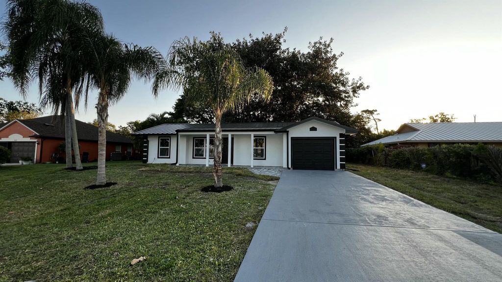 Photo of 1834 SE Bowie Street, Port Saint Lucie, FL 34952 (MLS # R11082198)