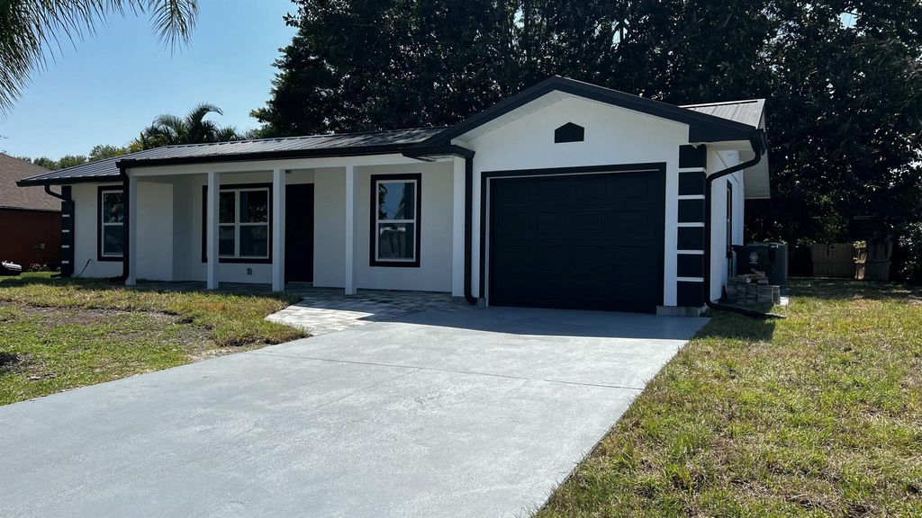 Photo of 1834 SE Bowie Street, Port Saint Lucie, FL 34952 (MLS # R11082198)