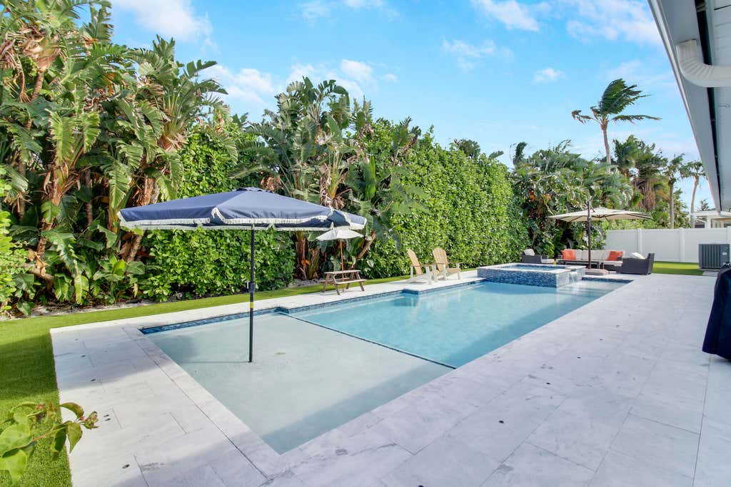 Photo of 52 Pinehill Trail E, Tequesta, FL 33469 (MLS # R11034874)