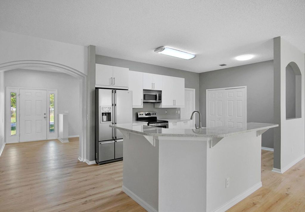 Photo of 2441 SW Barber Lane, Port Saint Lucie, FL 34984 (MLS # R10989067)