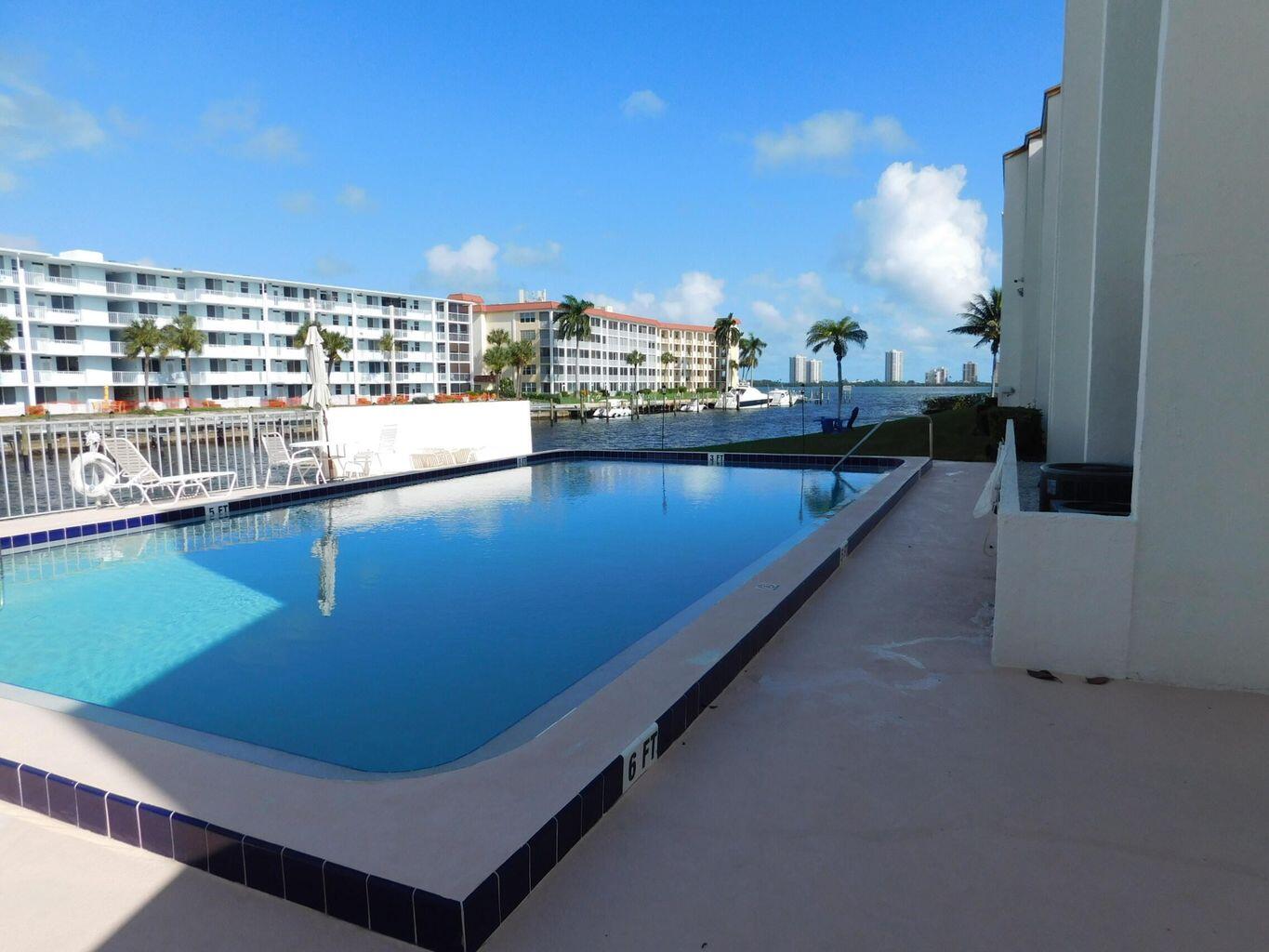 Prime Waterfront Living! Enjoy breathtaking Intracoastal views from this charming 1BR/1BA 2nd-floor condo with elevator access. Watch spectacular sunrises and sunsets or relax at the community pool overlooking the waterway. This residence offers accordion shutters, on-site laundry, one assigned parking space plus guest parking, and cable included. Ideally located within walking distance to dining and shopping and just minutes to the beaches. The building and pool sit on a canal with direct Intracoastal access. HOA requires a 650+ credit score. Annual lease only.