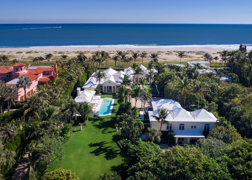 Along perhaps the most beautiful stretch of shoreline in Palm Beach, this serene and secluded compound enjoys 2.04 gated acres with 156' of frontage on the Atlantic Ocean.  The estate includes an impressive main residence, a private four-bedroom guesthouse and an inviting swimming pool with a delightful cabana. Outside, native flora gives way to manicured gardens and an expanse of lush oceanfront lawn.  Throughout the public spaces of the main residence--which include a living room, a formal dining room, a media room and a chef's kitchen--ceilings are voluminous, light is plentiful, and views of the ocean are direct and alluring. The kitchen is impeccably outfitted with white lacquer cabinetry, an island, two Wolf ovens, two cooktops, and a Sub-Zero refrigerator-freezer.