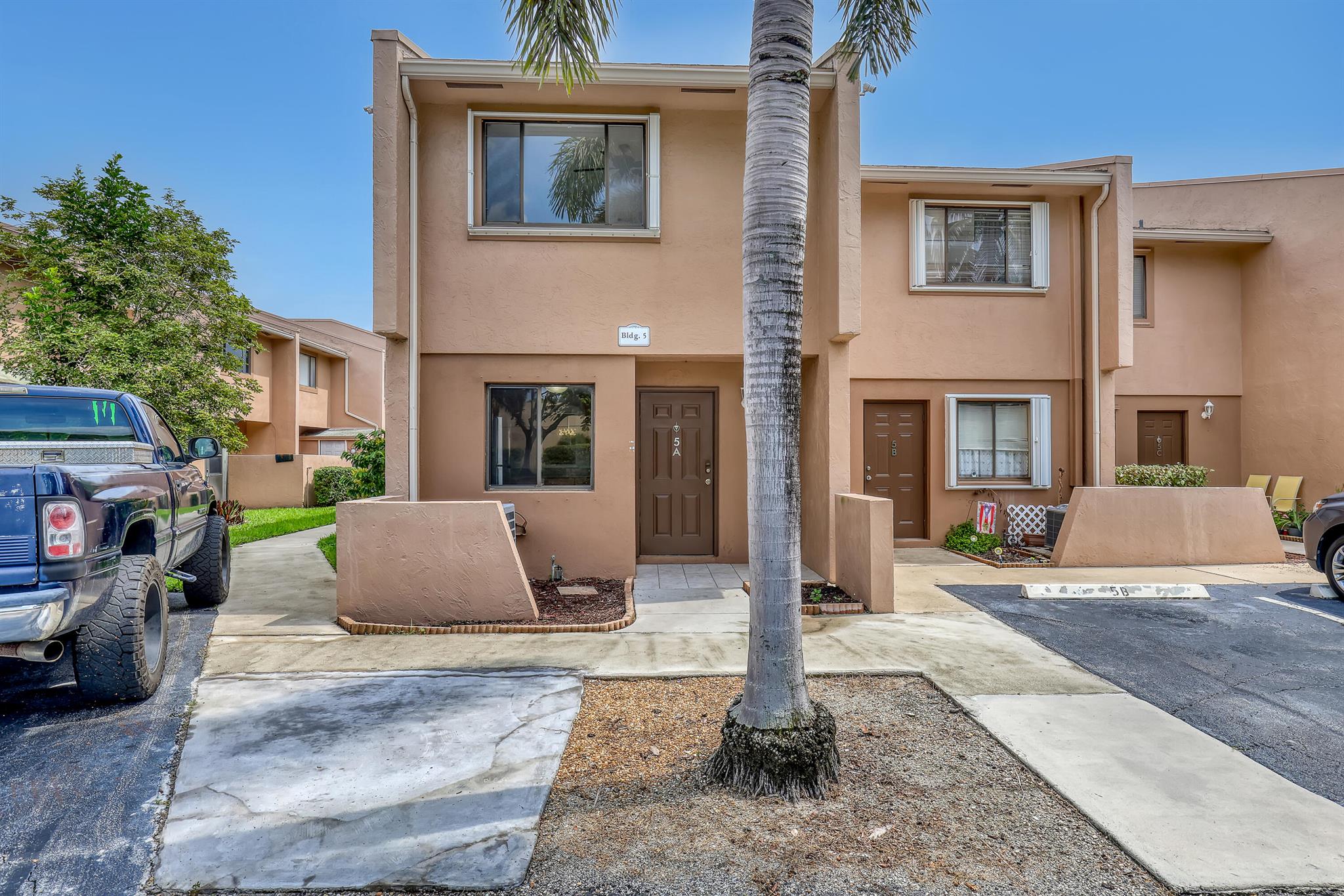 Welcome to this charming 3-bedroom, 2.5-bath corner Townhome in sought-after Royal Palm Village, located in the heart of Royal Palm Beach. This home is surrounded by parks, shopping, dining, and offers easy access to schools and highways.Inside, you'll find a spacious living room and bedrooms filled with natural light from large windows. The home features newer stainless steel kitchen appliances, granite countertops, and tile flooring. Enjoy comfort with a newer AC and water heater, along with hurricane shutters for added peace of mind. In addition, two designated parking spots right in front. The screened-in patio feels like a private yard, perfect for entertaining, with the community pool just steps away.The HOA covers roof maintenance, water, sewer, trash and