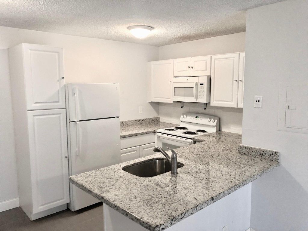 Photo of 651 Lyons Road #10104, Coconut Creek, FL 33063 (MLS # F10543915)