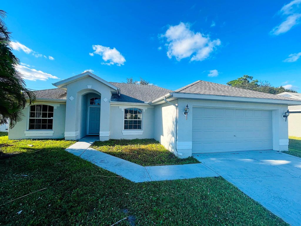 Photo of 1930 SW Glenco Street, Port Saint Lucie, FL 34953 (MLS # R11040979)