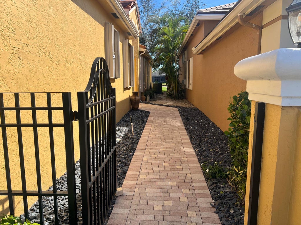 Photo of 4194 IMPERIAL ISLE Drive, Lake Worth, FL 33449 (MLS # B26072912)