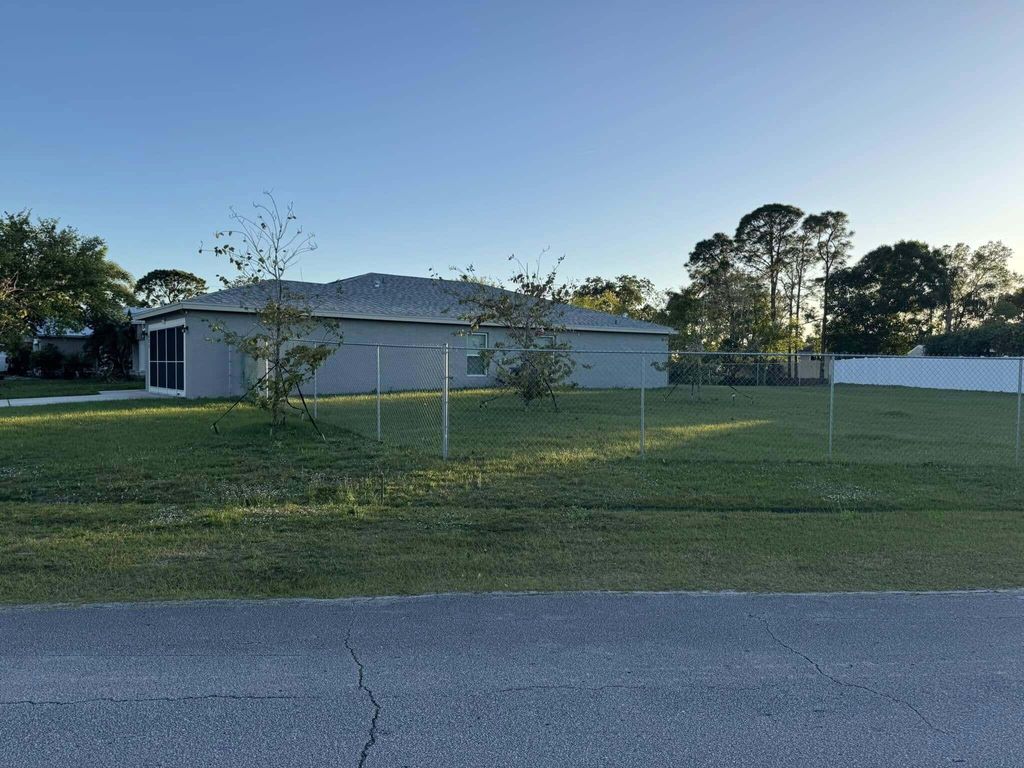 Photo of 425 NW Hutchins Street, Port Saint Lucie, FL 34983 (MLS # R11075029)