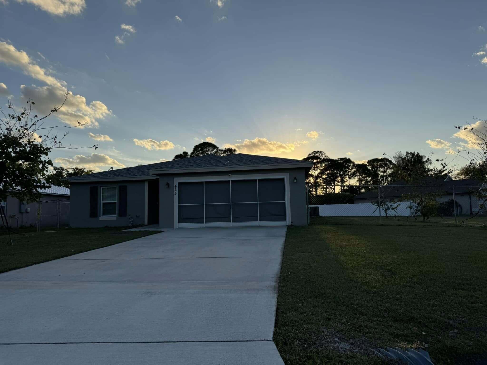 This home still looks and feels new! This 4/2/2 CBS home, built by Synergy builders, features quality construction, multiple energy efficient features, spacious kitchen/dining/living room area, large island in the kitchen, quartz counter-tops, plenty of cabinet space, plenty of counter space, stainless steel appliances, a fenced-in large .40 acre lot big enough to build a large building to house your boat or RV, plenty of backyard space to build a pool and make your own tropical paradise! Conveniently located near shopping and dining, and minutes from the beach. Schedule your private showing today.