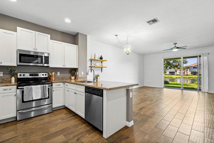 Welcome to this stylish waterfront home, built by D.R. Horton in 2017! This residence combines modern design with move-in-ready comfort! The upgraded kitchen boasts sleek finishes and stainless steel appliances, opening to a bright living area with wood-look porcelain tile floors and abundant natural light. The primary suite offers a fully renovated bathroom with a walk-in shower, designer tile, and premium fixtures. All bedrooms are generously sized with ample storage, and the in-unit washer and dryer add everyday convenience. Step outside to a private patio with tranquil water and fountain views, perfect for relaxing or entertaining. Ideally located near shopping, dining, and major highways, this home blends style, low-maintenance living, and a desirable waterfront lifestyle!