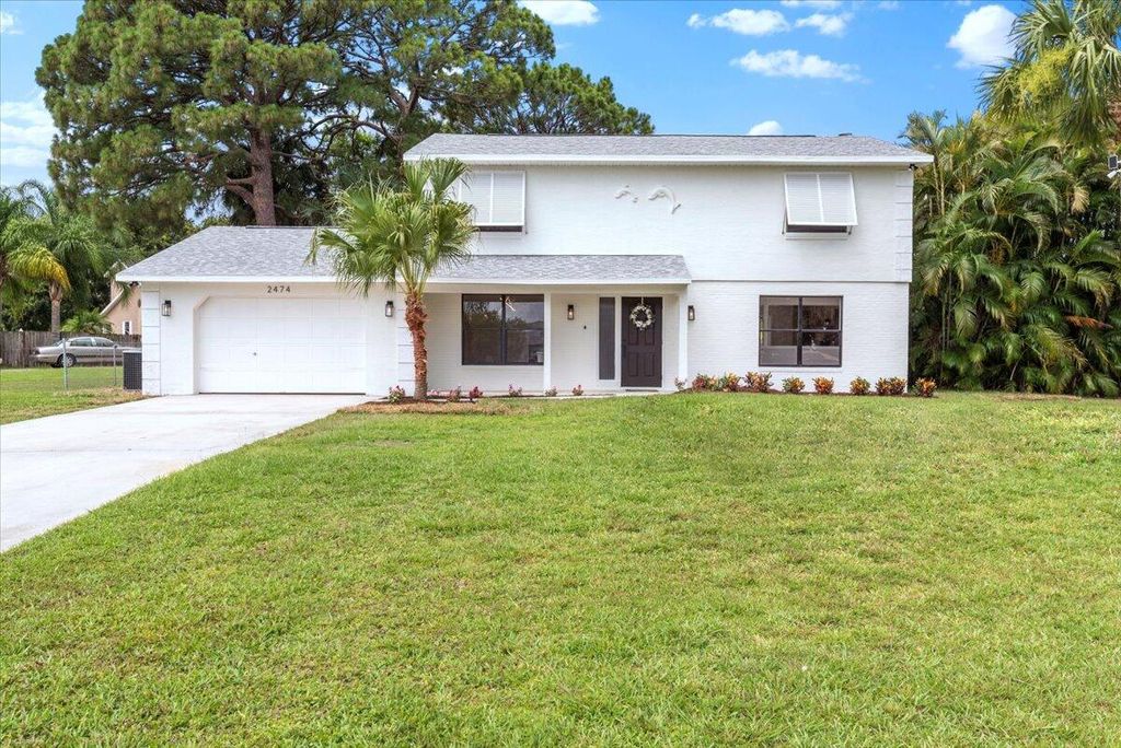 Photo of 2474 SE Calais Street, Port Saint Lucie, FL 34952 (MLS # R10993747)