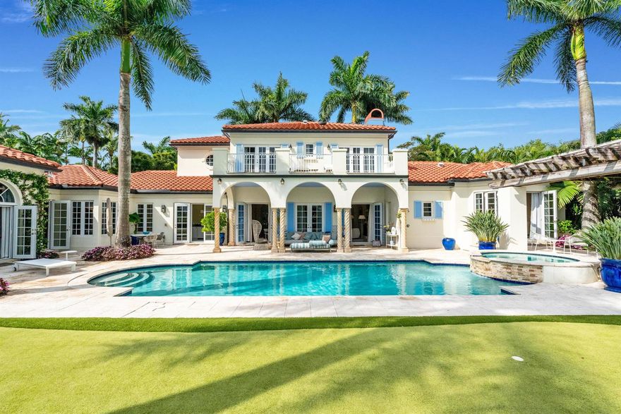 Luxury meets timeless elegance in this stunning 5-bedroom, 6.1-bath estate in the Palm Beach Polo Club, surrounded by lush tropical landscaping and serene preserve views. From the moment you enter through the private front courtyard, you'll be captivated by the European-inspired charm, marble and wood flooring, and abundant natural light streaming through custom shutters and French doors. The thoughtfully designed floor plan offers a 3-way bedroom split for ultimate privacy. The primary suite is conveniently located on the main floor, featuring direct access to a tranquil sitting area under a pergola by the pool. Upstairs, two bedrooms and two baths overlook the preserve from a private balcony, while an additional two-bedroom, two-bath guest suite sits above the 3-car garage,
