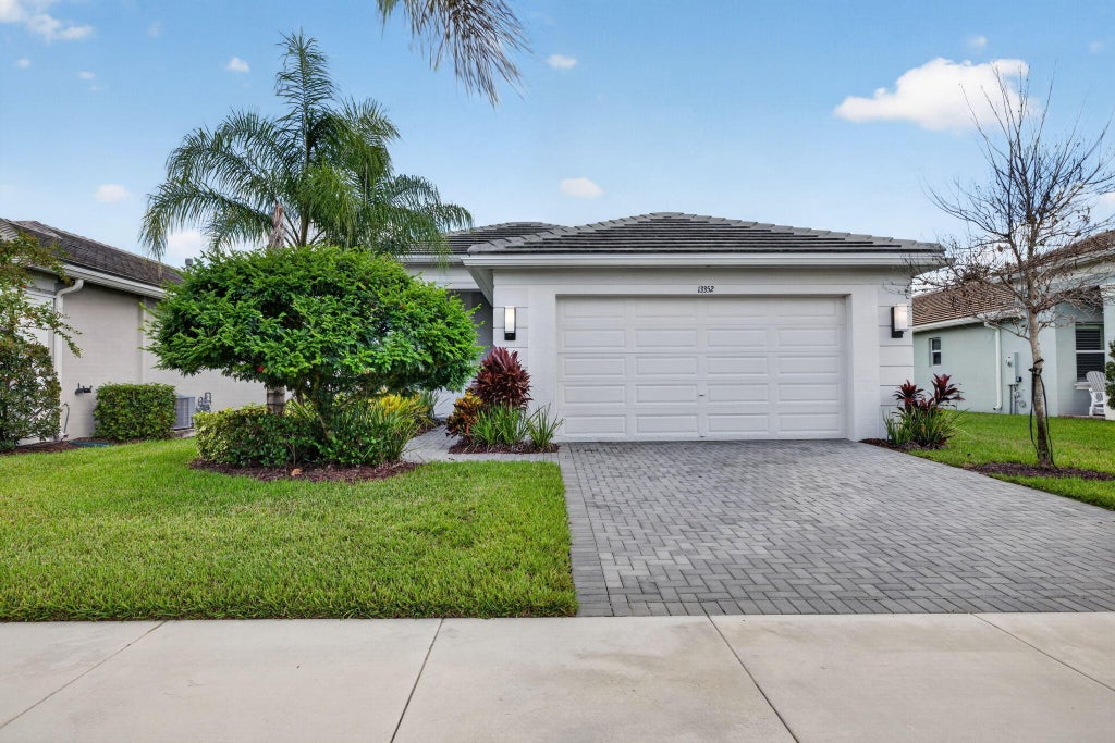 Photo of 13352 SW River Rock Road, Port Saint Lucie, FL 34987 (MLS # B26038287)