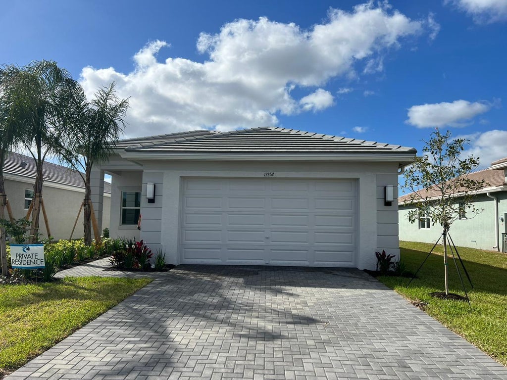 Photo of 13352 SW River Rock Road, Port Saint Lucie, FL 34987 (MLS # B26038287)