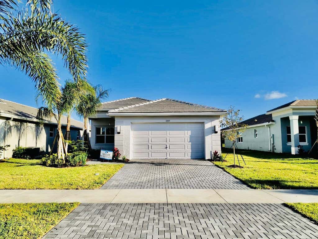 Photo of 13352 SW River Rock Road, Port Saint Lucie, FL 34987 (MLS # B26038287)