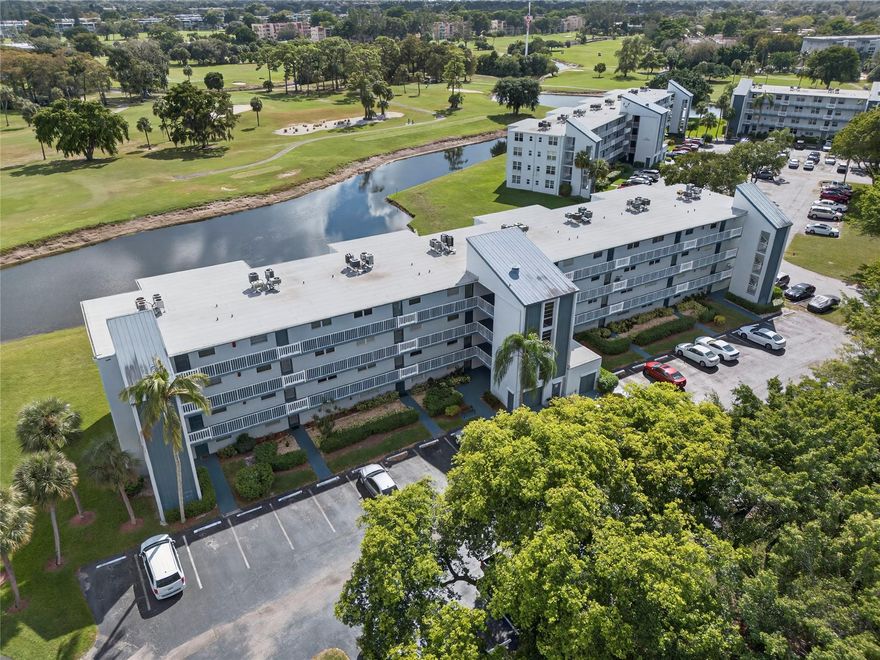 Enter and go "Ahhhh" I'm home.  Beautifully updated 2BR/2BA condo with serene, screened balcony on water.  Neutral tile flooring throughout.  A/C 2025.  HWH 2024.  Impact windows and doors (except entry).  Washer/Dryer in unit.  55+ community has 2 pools, clubhouse has fitness room, billiards room, community/theater room, and so much more.  No lease for 2 years.  New roof and elevator October 2025.  No new assessments planned for 2026.  The association passed the 40-year inspection 2024.  New pavers at the pool.  Clubhouse and pool directly across from the building.  Partially furnished.