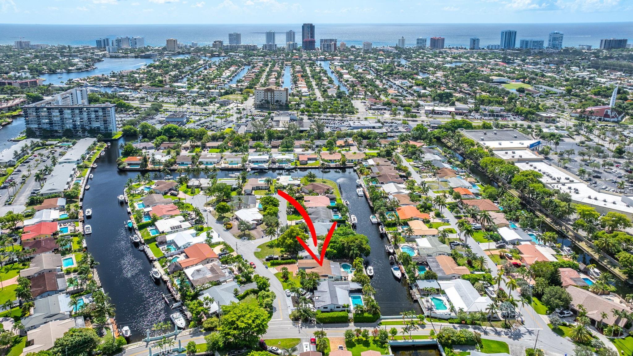 RARE NO-HOA waterfront home with a 2-car garage on private cul-de-sac island in amazing neighborhood. You'll love the 70' x 8' concrete seawall/dock with boat whips & jet ski hoist. Direct ocean access at Hillsboro Inlet is 15 minutes away. The gourmet kitchen sits at the heart of this open, light-filled floor plan with quartz countertops, custom cabinets, and SS appliances. Impact windows and doors provide added convenience and draw the eye to your own tropical oasis, backyard, and Florida Room. 2 HVAC (zoned), tankless water heater, upgraded electrical panel. Ext Paint in 2024. This home offers the best of coastal living whether you enjoy entertaining pool/spa side, hoping on the boat, or just relaxing! 5-10 minutes from schools, hospitals, shopping, dining, and the beach! You're HOME!