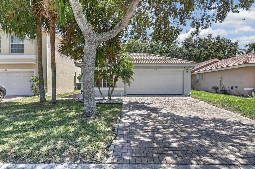 Photo of 5088 NORTHERN LIGHTS Drive, Greenacres, FL 33463 (MLS # B26066629)