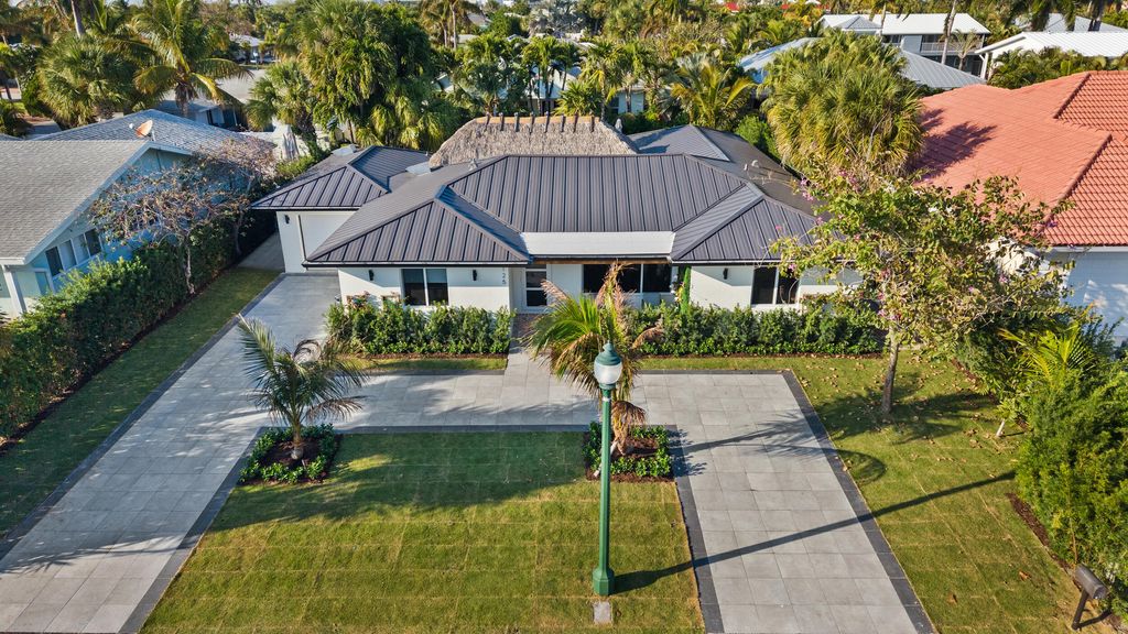 Photo of 125 Cascade Lane, Riviera Beach, FL 33404 (MLS # R11166172)