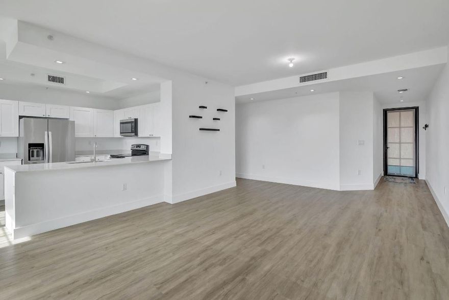 You'll love living in one of the larger 818 square foot units in Main Street Lofts. The beautiful sunsets from your 3rd story balcony are the absolute best, and coming home to nearly-new construction makes life so much better. From the gorgeous LVT flooring and quartz countertops to the impact windows and doors, this affordable condo is truly a stunner! You're located right in the heart of the city with so many things to do, and you are able to rent this property out as an investment property. Come check it out...you'll love the views!