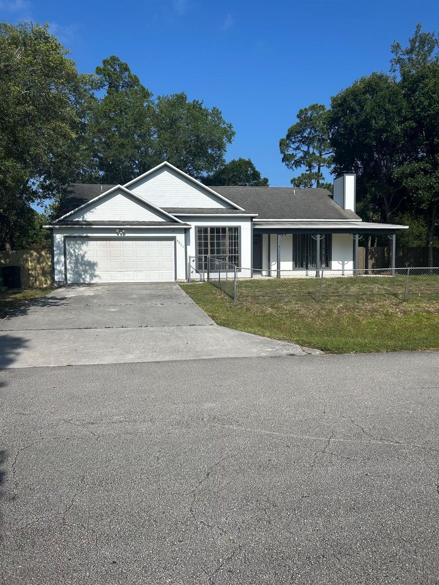 This is a beautiful 3-bedroom, 2-bathroom home with a 2-car garage, located in Lakewood Park, Florida. The property features a new fenced backyard, perfect for children and pets to play safely. The living room includes a cozy fireplace, and there is a screened-in back patio to enjoy. The home is conveniently situated just minutes from Vero Beach and offers easy access to the interstate for commuting.
