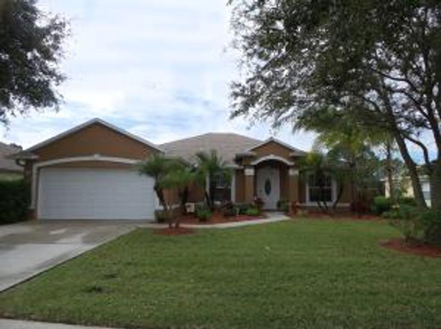 Discover this beautiful 4/2/2 situated in Sawgrass Lakes. This home offers: vaulted ceilings, skylights, plant shelving, hand scraped engineered wood floors, kitchen boasts stainless steel appliances and solid wood cabinets. Split floor plan, inside laundry room with front load washer/dryer, walk-in closets, garden tub and separate shower in the master bath. There's also a  spacious screened patio over looking a huge back yard. This home is move ready don't miss out!