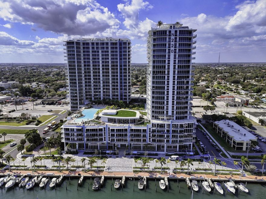Welcome to Nautilus 220—where brand-new waterfront luxury meets an elevated, amenity-rich coastal lifestyle. Ideally positioned on the highly desirable 6th-floor amenity level, this stunning 2-bedroom plus den, 2.5-bath residence with over 1,840 SF offers a rare blend of sophistication, convenience, and immediate access to the building's premier offerings.  Designed to impress, the home features dramatic 12.5-foot ceilings—among the highest in the building—creating a striking sense of volume, light, and architectural distinction that truly sets it apart. Expansive floor-to-ceiling impact glass bathes the interiors in natural light while framing sweeping views of the marina and city skyline. The designer chef's kitchen is a true centerpiece, showcasing sleek Quartz countertops, premium Miele appliances, and refined modern finishes—perfectly suited for both everyday living and elegant entertaining. Smart-home ready with customizable technology, the residence seamlessly blends innovation with timeless design.  Step onto your private terrace—an inviting outdoor retreat ideal for relaxing or entertaining while enjoying serene water and city vistas in the heart of Lake Park.  What makes this residence exceptionally compelling is its coveted 6th-floor location, placing you just steps from Nautilus 220's extraordinary resort-style amenity level. Enjoy effortless access to the pool and spa, private cabanas, yoga deck, summer kitchen and pavilion, gazebo lounge with fire pit, and putting green—all just outside your door. Inside, the wellness plaza offers a state-of-the-art fitness center, spin studio, yoga rooms, steam, and sauna, creating a true resort experience at home. Nautilus 220 delivers a full-service luxury lifestyle with valet and secure garage parking, a grand attended lobby, and 24-hour security. Residents also enjoy world-class dining at SeaHawk Prime by renowned chef David Burke, along with an impressive collection of entertainment amenities including a golf and sports simulator, private bowling lounge with bar, rooftop infinity pool and spa, and an observation deck with sweeping views of the Intracoastal and Atlantic Ocean. As an exceptional added incentive, the owner will consider paying the remaining balance of 2026 condominium fees for the new buyer—offering immediate value and added peace of mind. Be the very first to reside in this exceptional waterfront residence, where soaring ceilings, premier 6th-floor access, and unparalleled amenities create a truly unmatched living experience.