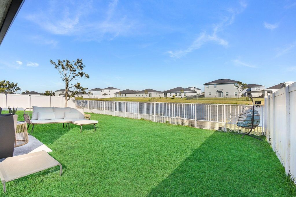 Photo of 113 Dabou Loop, Belle Glade, FL 33430 (MLS # R11162162)