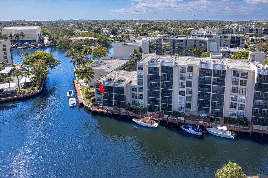 Love where you live with the luxury of waterfront living in Boca Bayou, a gated community with a welcoming vibe. Set on 46 acres of richly green and landscaped grounds, Boca Bayou offers friendly, resort-style living. Neighborhood features 5 heated pools, tennis, pickleball, fitness centers, saunas, bocce, shuffleboard, grilling stations, and even car wash stations - all secured by 24-hour manned gates. The new clubhouse is nearly complete. This 2 bed 2 bath corner unit is situated on the 2nd floor with a serene canal view. It has hurricane impact sliding doors and a brand new front door with screen door to take advantage of those waterfront breezes. The unit CAN be sold fully furnished (with a light and airy coastal vibe) for a turnkey experience - just bring your toothbrush (or purchase without furniture and bring your own flavor to this bright and spacious condo). From your private screened-in balcony, enjoy the sparkling views in this waterfront boating community. Unit comes with assigned parking space close to the elevator and community features abundant guest parking. Owners can rent immediately, so it's a great neighborhood for investors, but units can only be rented once per year.