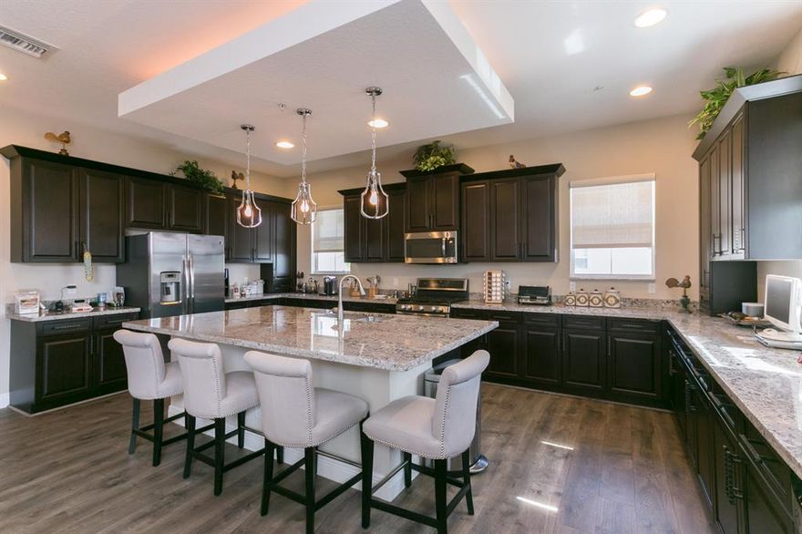 Leased and tenant occupied until 5/31/2021. Corner Town A model overlooking the lake to the West and a rare 1 level single family to the South for the most open Alton views. The 1,122 Sq. Ft. great room and 9x5 kitchen island make this main family area larger than some homes twice the size. End units have 10 extra impact windows with great natural light. Interior features include 10 ft. ceilings and 8 ft. doorways, owners bath beach entry shower and coffered ceilings in bedrooms. 2 balconies plus a patio for outdoor space and a full size 2 car garage. The Club at Alton (0.1 Miles) and The Alton Town Center (0.5 Miles) allow for a truly walkable lifestyle. The Club at Alton features high quality amenities and the Town Center has groceries, dining, shoppes and services.