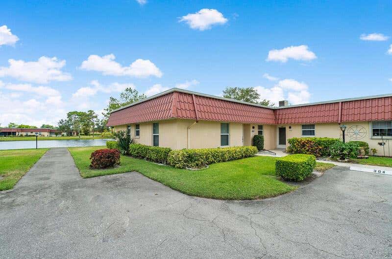 Photo of 302 Cape Cod Circle Cir, Lake Worth, FL 33467 (MLS # R10721050)