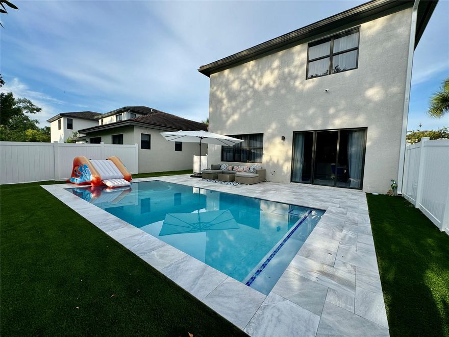 Experience South Florida living at its finest in this beautifully renovated 4-bed 4-bath pool home located in a prestigious gated community on Whispering Way. This spacious residence combines modern design, comfort, and complete privacy. Featuring an open-concept layout with high ceilings, the home is filled with natural light The gourmet kitchen is equipped with stainless steel appliances, quartz countertops, large center island. Step outside to your private fenced backyard oasis, complete with a sparkling swimming pool, spacious patio, and lush landscapin — ideal for relaxing, and enjoying Florida’s year-round sunshine. Washer & dryer. Large driveway with multiple parking spaces. Perfectly situated minutes from Publix, Dania Pointe, Fort Lauderdale Airport, I-95, beaches, parks, schools