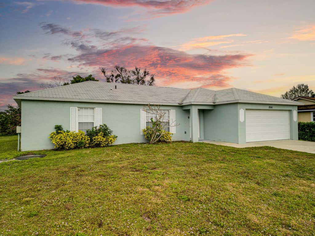 Photo of 2041 SW Judith Lane, Port Saint Lucie, FL 34953 (MLS # R10952083)