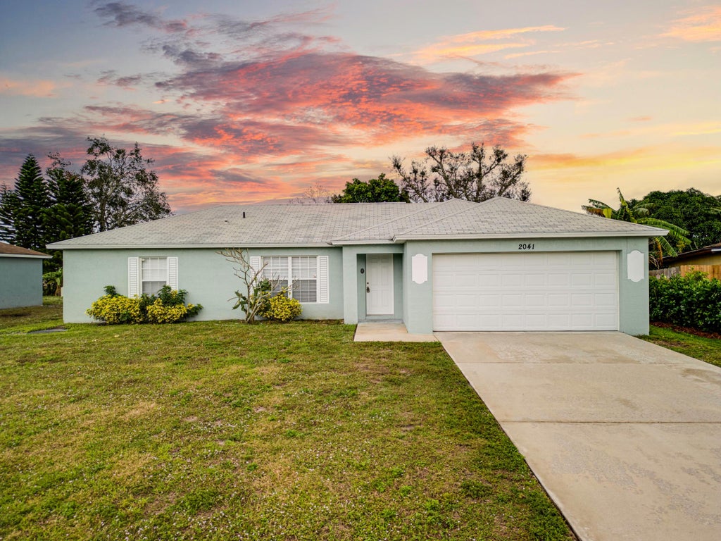Photo of 2041 SW Judith Lane, Port Saint Lucie, FL 34953 (MLS # R10952083)