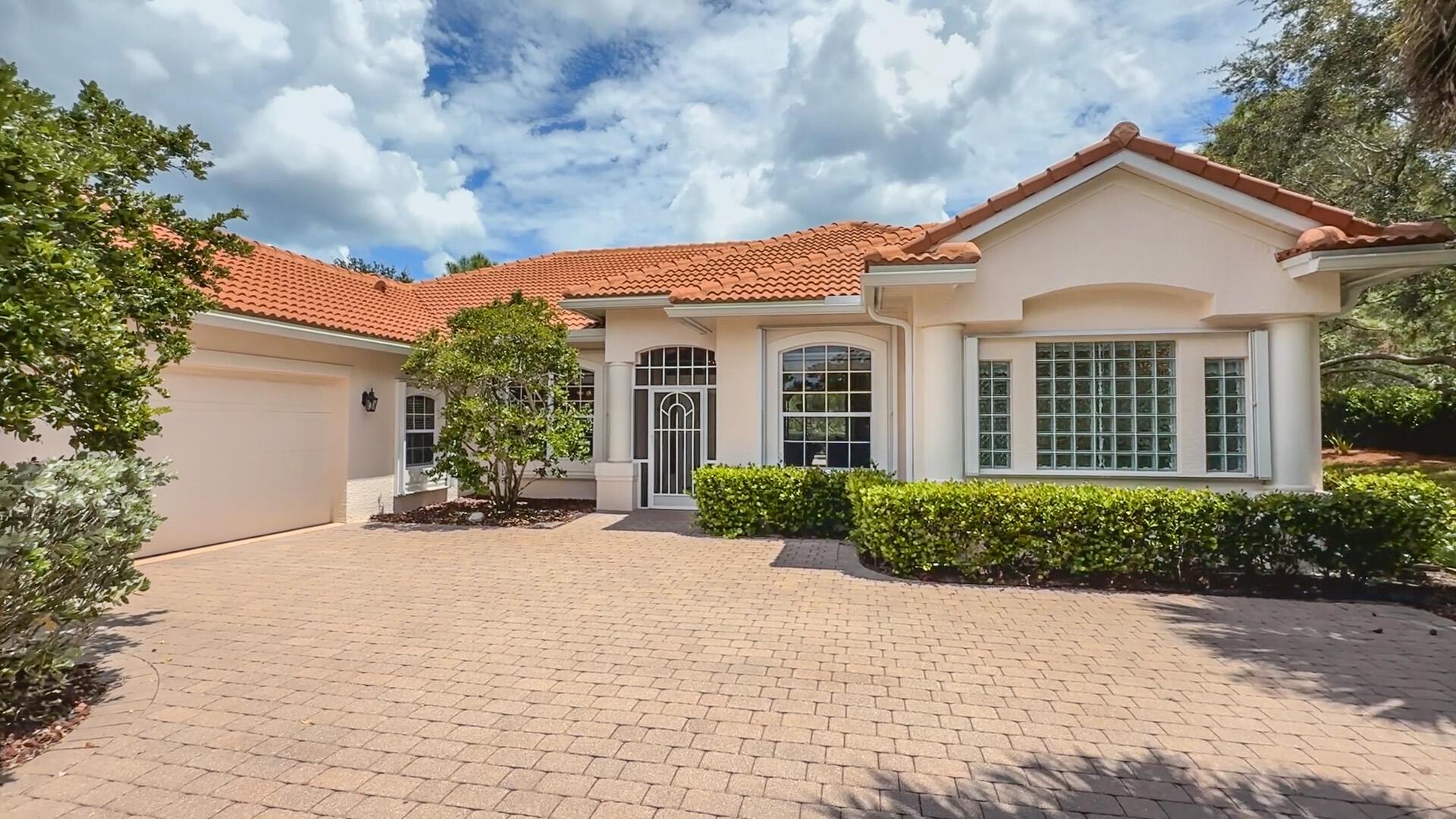 Jensen Beach Country Club's pinnacle location of Opal Hill Estates. Opal Hill Estates consists of 6 properties that are tucked far back into the community, situated on half-acre lots. Original owner and extremely well-maintained property! New roof 2023. This estate backs to a private preserve with expansive distance between adjoining neighboring estates. Over 2,400 square feet of living space consisting of 3 bedrooms, a den/office, and 2 bathrooms. The pool area is a private outdoor oasis of living space with a covered patio area and an expansive screened lanai. These estate properties rarely become available for sale and are highly desired. Amenities provided by the HOA are lawn and landscaping maintenance, Lawn Irrigation, Lawn Pest Control and Fertilization, Basic Cable, and internet