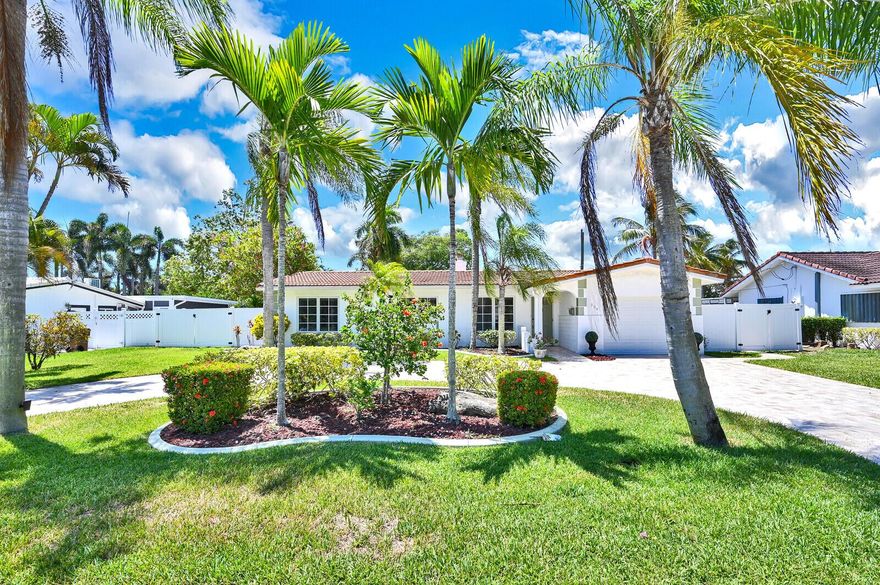 Short term rental in Deerfield Beach's desirable COVE has it ALL, Sprawling at 2400 sq ft w/enough room for each family member to enjoy his/her own space! The home features 4 large bedrooms, spacious & open living room + formal dining area, cozy bkfst nook, + large family room off yard. Beautiful chef's kitchen overlooks pool & boasts large cooking island, SS appliances & tons of cabinetry. XL fenced, private backyard is a true entertainer's oasis w free-form HEATED pool, travertine patio, XL tiki hut w/ projector screen, hammock, swings, TV & grill. Turnkey. Flexible date options available.
