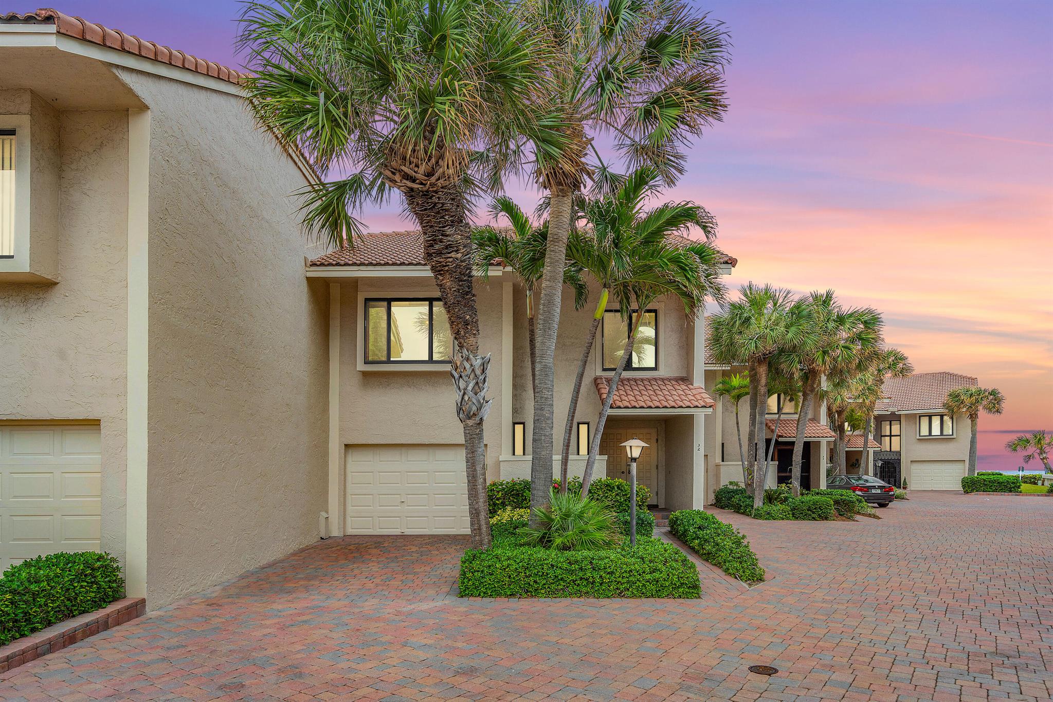 BEACH AND SAND steps away from your home at Dunes of Ocean Ridge! Lowest Price per square foot ON THE SAND. This is your opportunity, don't let it get away!Spectacular & exclusive gated beachside community of only 36 homes steps from the Ocean delivers this 3 bed, 2.5 bath two-story townhome with an unparalleled blend of modern elegance and seaside charm.Discover a spacious open floor plan, soaring ceilings, flooded with natural light & adorned with high-end finishes making this home move-in ready. The chef's kitchen boasts stainless steel appliances, quartz countertops, large island with breakfast bar perfect for entertaining. Ocean Views from dining, kitchen, family, patio, & primary.
